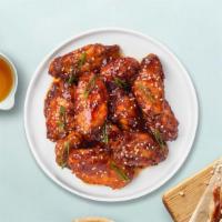 Teriyaki Plunge Wings · Deep-fried wings tossed in Asian teriyaki glaze, served with a side of ranch dressing.