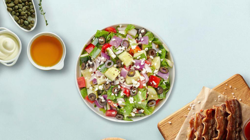 Hide And Greek Salad · Romaine lettuce, tomatoes, artichoke hearts, onions, cucumber, olives, feta cheese, carrots, pepperoncini.