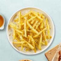Cheese Fries Chronicles · Idaho potato fries cooked until golden brown and garnished with cheese.