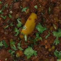 Lamb Bhuna · Marinated lamb cooked with spices and herbs.