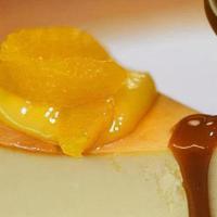 New York Cheesecake · Classic preparation, topped with caramel & fresh citrus