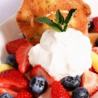 Fresh Fruit & Chantilly Cream · Mixture of strawberries, blueberries, pineapple topped with housemade chantilly whipped crea...