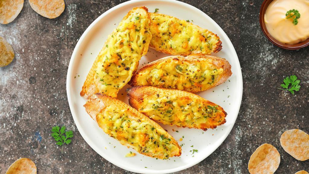 Cheesy Boolean Garlic Bread · Housemade bread toasted and garnished with butter, garlic, mozzarella cheese, and parsley.