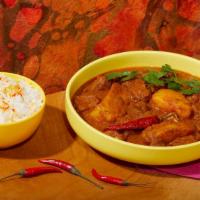 Lamb Vindaloo · Spicy lamb in a curry sauce. Includes side of Rice.