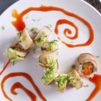 Veggie Dragon Rolls (Soy paper ) · Tempura yam, deep fried asparagus, cucumber and gobo, topped  with avocado, eggplant, green ...