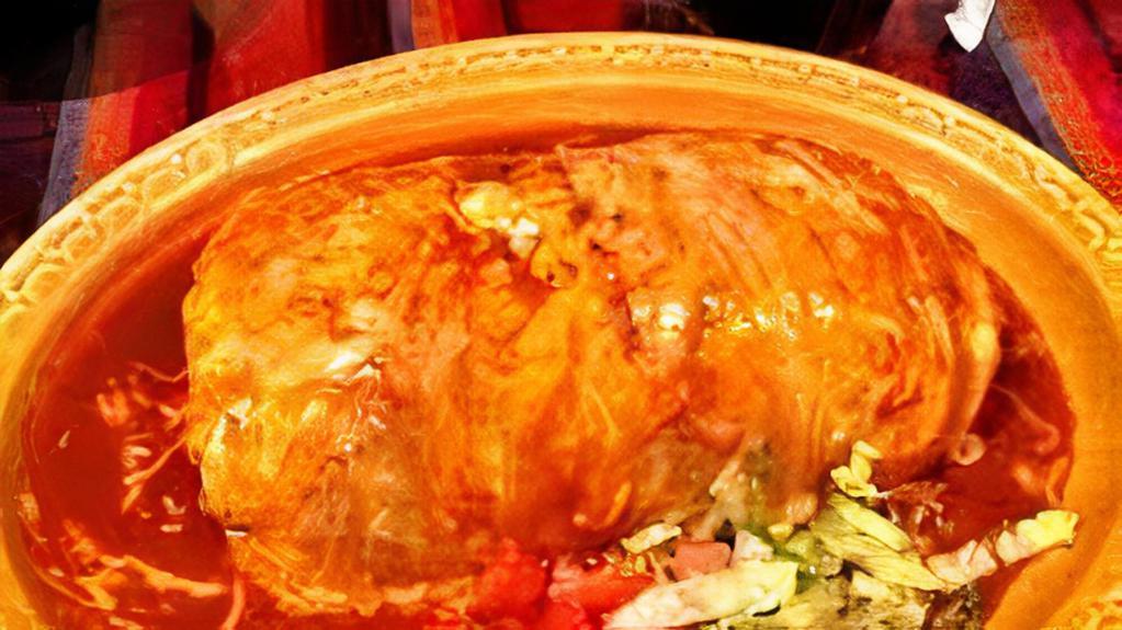 Azteca · Wet burrito with mole , meat , beans , rice , guacamole, pico , sour cream , cheese