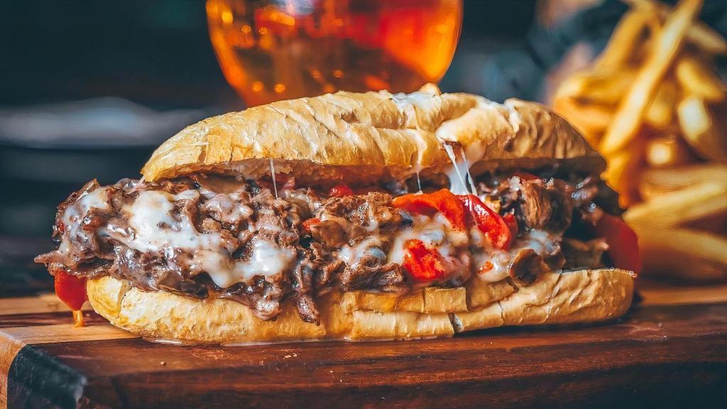 The Champ · Mushrooms, roasted red bell peppers, Provolone. Our steaks are custom made, straight outta Philly. Served on the famous Amoroso's roll and served with a side of fries.