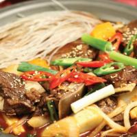 7. GalBi-JJim | 갈비찜 · Korean style braised beef short rib with assorted vegetable.