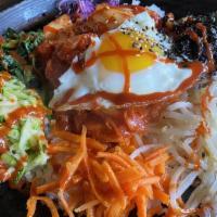 Bibimbap · Spicy. Rice topped with beef and assorted vegetable. With spicy sauce.
