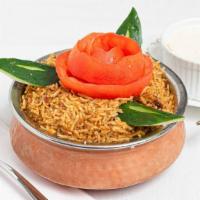 Chicken Biryani · Basmati Indian rice flavored with saffron and nuts then cooked with mildly spiced chicken in...