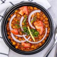 Chana Masala · Garbanzo beans cooked with Indian sauces and herbs.