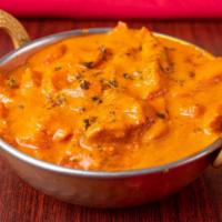 Butter Chicken · Chicken in creamy sauce cooked with Indian herbs.