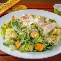 Caesar With Chicken · Chicken, fresh crisp romaine, a generous portion of shredded Parmesan cheese, and seasoned c...