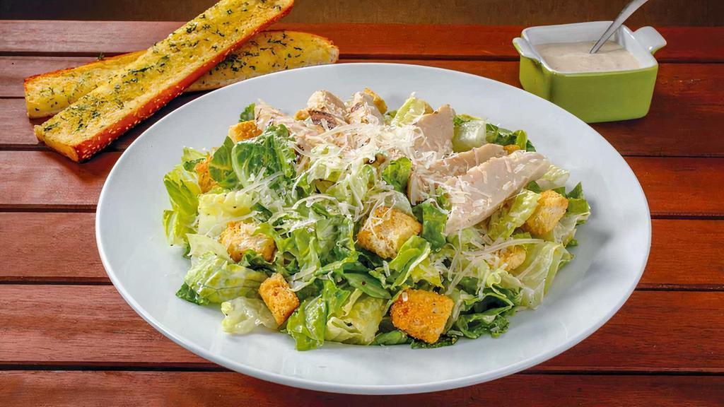 Caesar With Chicken · Chicken, fresh crisp romaine, a generous portion of shredded Parmesan cheese, and seasoned croutons to top it off. 1010 cal.