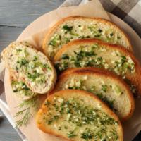 Garlic Bread (2pc) · Toasted Bread Topped with Garlic Pesto, and Mozzarella Cheese