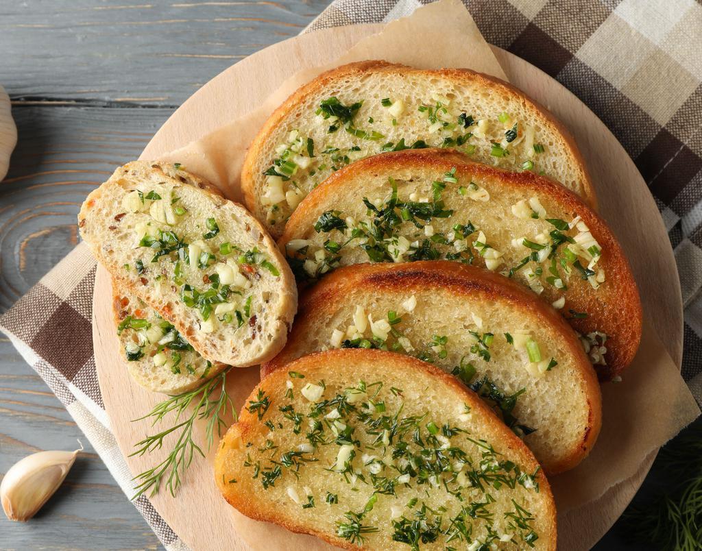 Garlic Bread (2pc) · Toasted Bread Topped with Garlic Pesto, and Mozzarella Cheese