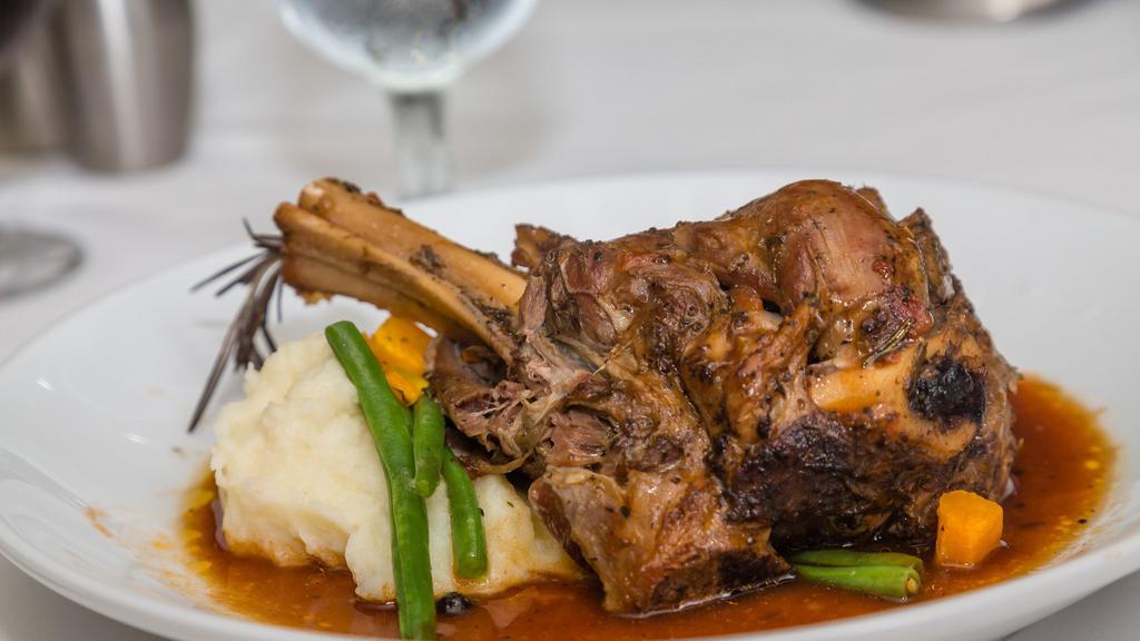 Lamb Shank · Flavorful tender Lamb Leg cooked to perfection. Comes with a side of creamy mashed potatoes and vegetables