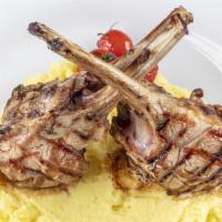 Lamb Rack · Grilled and Seasoned Lamb Rack cooked to perfection. Comes with a side of creamy mashed pota...