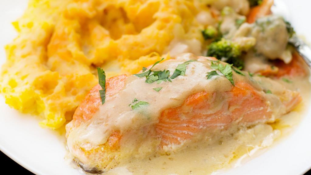 Salmon Piccata · Freshly Grilled and Perfectly Seasoned Salmon Filet Coated with Creamy Piccata Sauce. Comes with a side of creamy mashed potatoes and vegetables