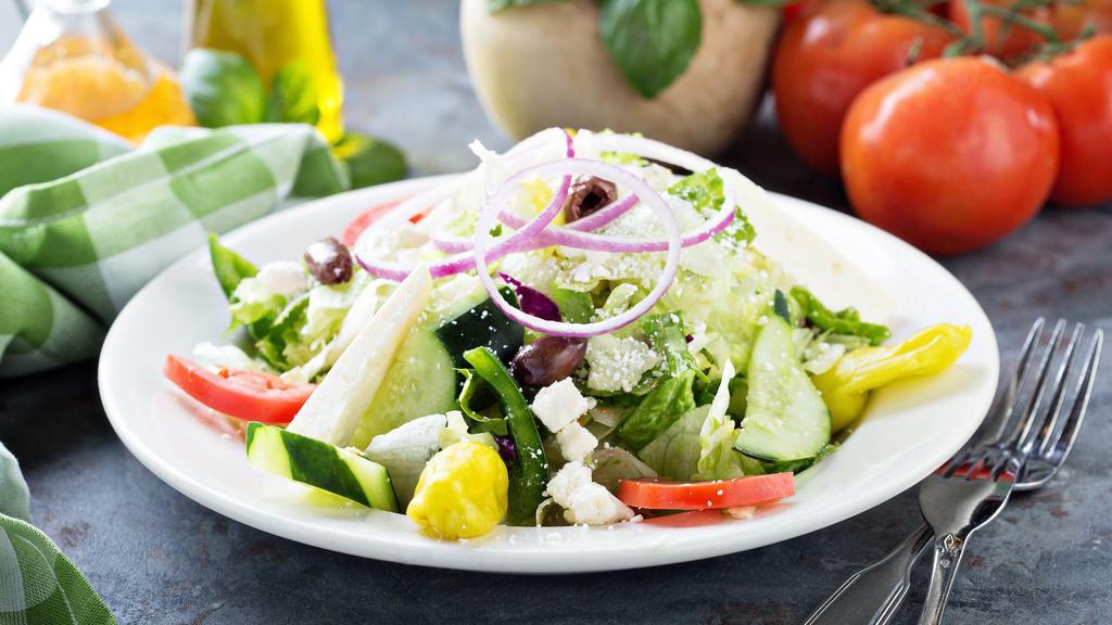 House Salad · Fresh Salad with Tomatoes, Cucumbers, Red Onions, and Mixed Greens served with Italian Heart Vinaigrette