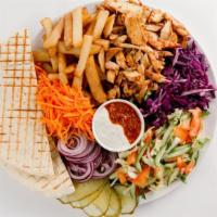 Chicken Shawarma Plate · Juicy, thinly sliced, spit-roasted chicken shawarma seasoned to perfection. Served with crea...