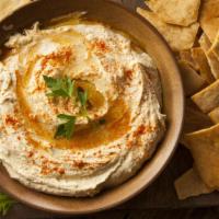 Smoked Paprika Hummus & Pita Chips · Our classic, creamy hummus, served with a side of crispy, baked, smoked paprika seasoned pit...
