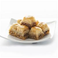Walnut Baklava · Delicate layered filo pastry, filled with finely chopped walnuts and drenched with honey.
