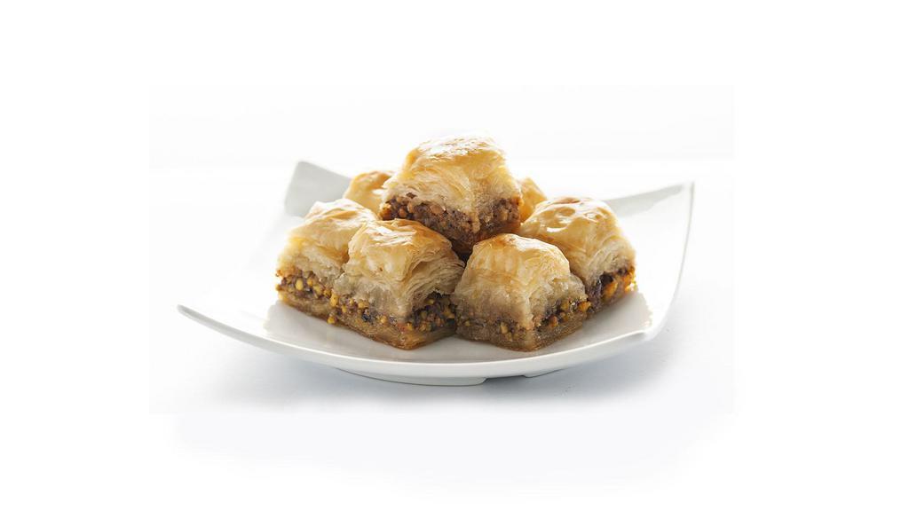 Walnut Baklava · Delicate layered filo pastry, filled with finely chopped walnuts and drenched with honey.