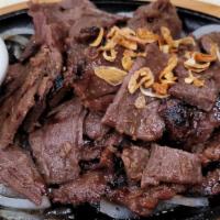Sizzling Charbroiled Beef · Strips of beef marinated in lemongrass.
