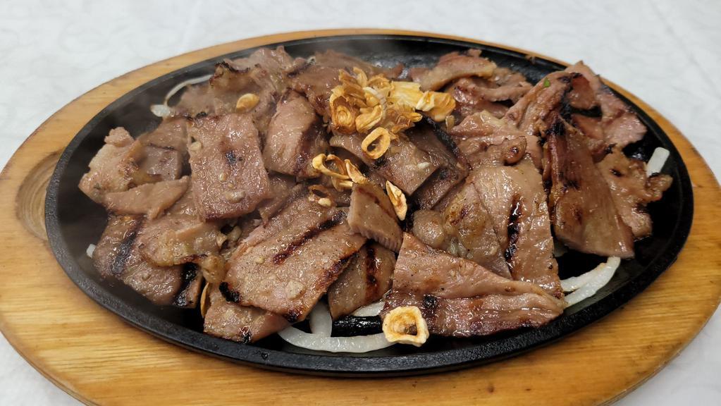 Sizzling Charbroiled Pork · Thinly sliced pork loins marinated in lemongrass.