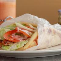 Chicken Gyro · chicken wrapped in fluffy pita bread with lettuce, tomatoes, onion, and tsaziki sauce.