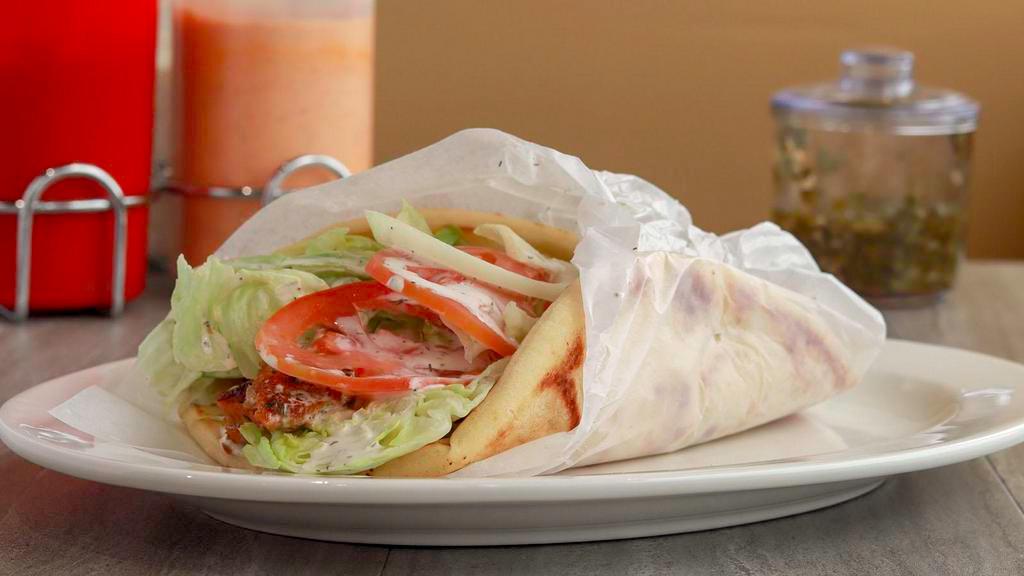 Chicken Gyro · chicken wrapped in fluffy pita bread with lettuce, tomatoes, onion, and tsaziki sauce.