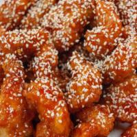 #23 Sesame Chicken · Served with (1) Egg Roll & Plain Fried Rice