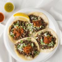 Tacos · Onions cilantro & salsa