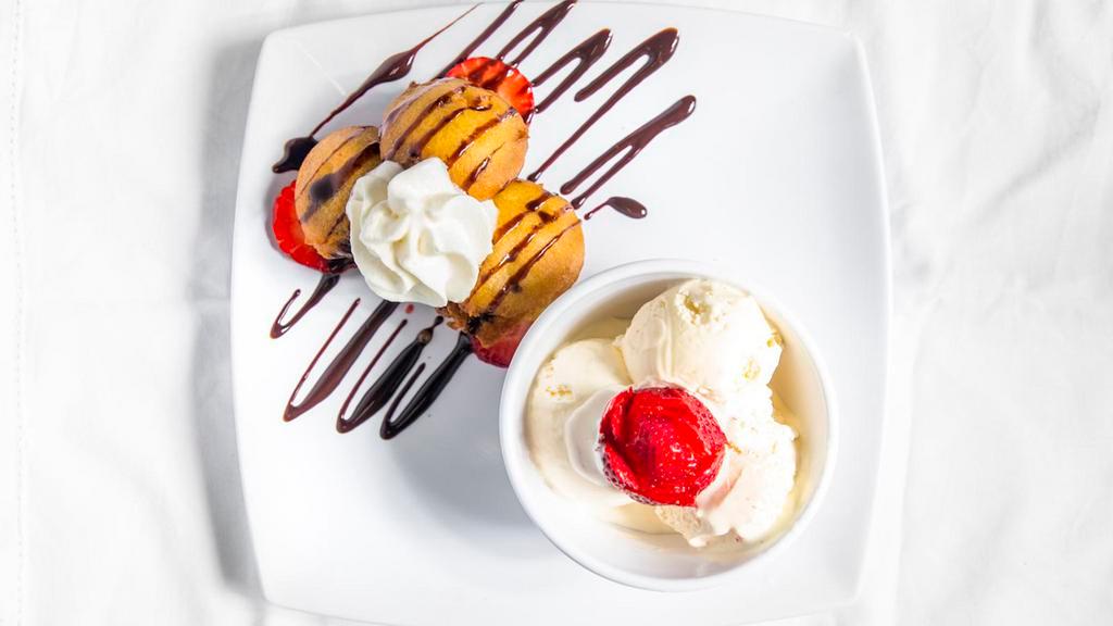 Deep-Fried Oreos With Ice Cream · With vanilla ice cream and fresh strawberries.