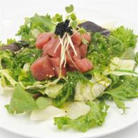 Hawaii Poke Salad · Tuna, spring mix seaweed salad & tobiko w/poke sauce.