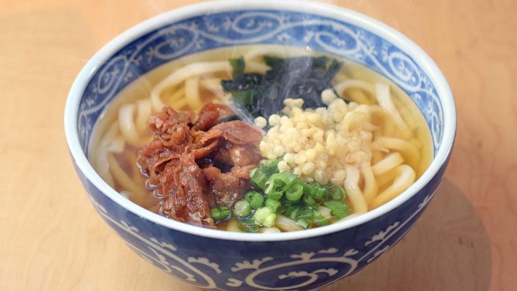 952. Niku Udon · Hot udon noodle soup topped with beef sukiyaki​