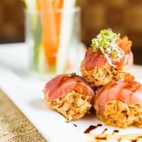 Cherry Bomb (Each) · Spicy crab meat wrapped with raw fish.