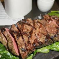 Steak* · flat iron, sizzling river stone, garlic spinach, ponzu