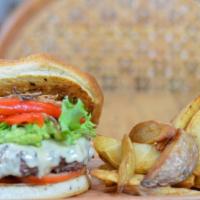 California Burger · Home made focaccia bun, aioli, grass fed beef patty, shallots, roasted pepper, tomato, arugu...