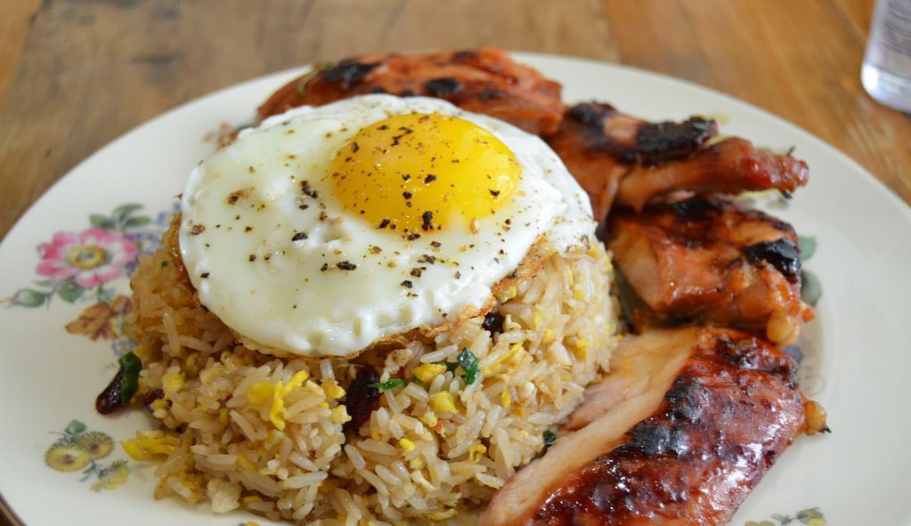 BBQ Chicken with fried rice · Grilled chicken, Schilling fried rice; egg, cranberry, cashew, scallion, pineapple and fried egg on top