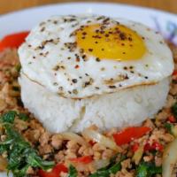 Basil Chicken (Pad Ka Prow) · Jasmine rice with ground chicken, basil leaves, Thai chili, garlic, onion, bell pepper, frie...