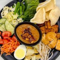 Gado Gado · Tempeh, tofu, egg, bean sprouts, cabbage, string beans + cherry tomatoes salad; served with ...