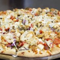 Chicken Pesto Gourmet Pizza · Chicken, mushroom, red onions, tomatoes, garlic, pesto sauce, and mozzarella cheese.