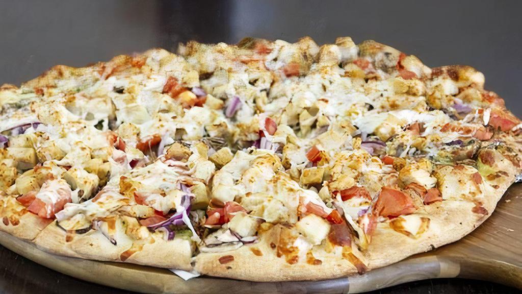 Chicken Pesto Gourmet Pizza · Chicken, mushroom, red onions, tomatoes, garlic, pesto sauce, and mozzarella cheese.