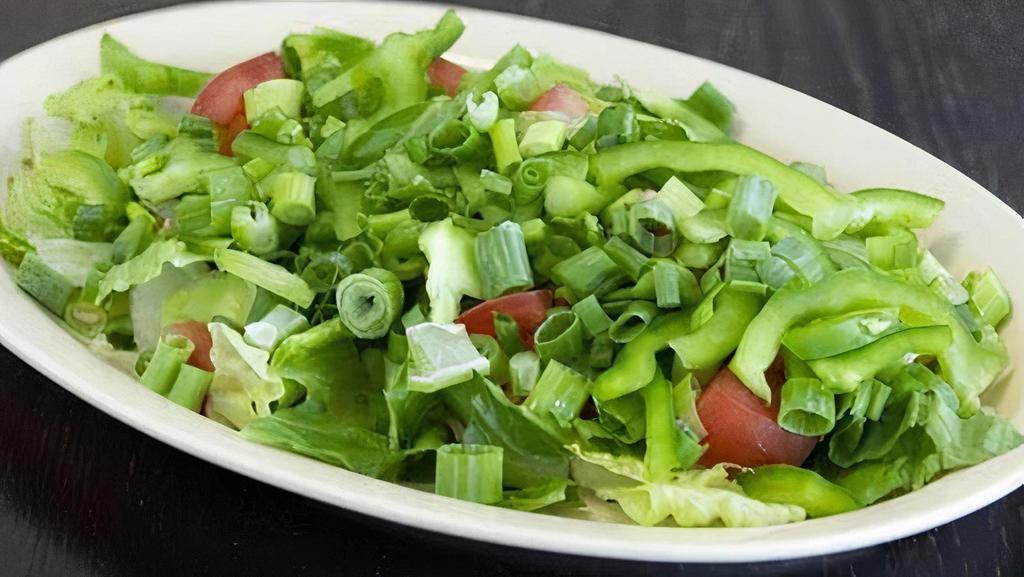 House Salad · Romaine lettuce, green onions, tomatoes, bell peppers, and ranch dressing.