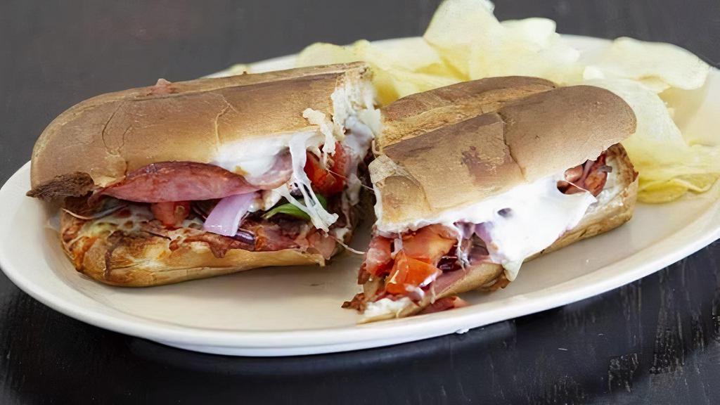 Ham Club Sandwich · Crabmeat, red onions, artichoke, green onions, tomatoes, a sourdough roll, and cheese.