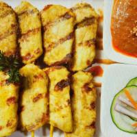 Chicken Satay · Grilled marinated sliced chicken breast on skewers. Served with cucumber salad and peanut sa...