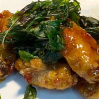 Spicy Wing · Deep-fried chicken wing until crispy. Topped with chili-garlic sauce and crispy basil.