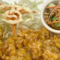 Corn Cake (Vegetarian) · Thai-style fried corn cake. Served with cucumber salad.
